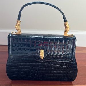 Black leather bag with gold accents